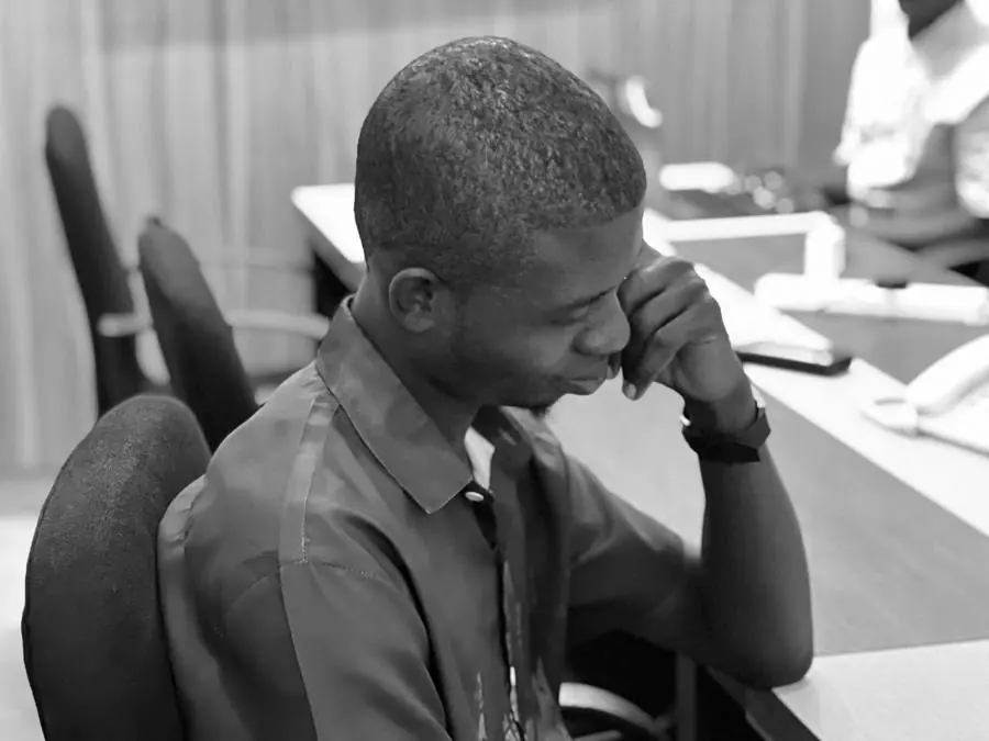Olaitan Adebayo at a desk, thinking